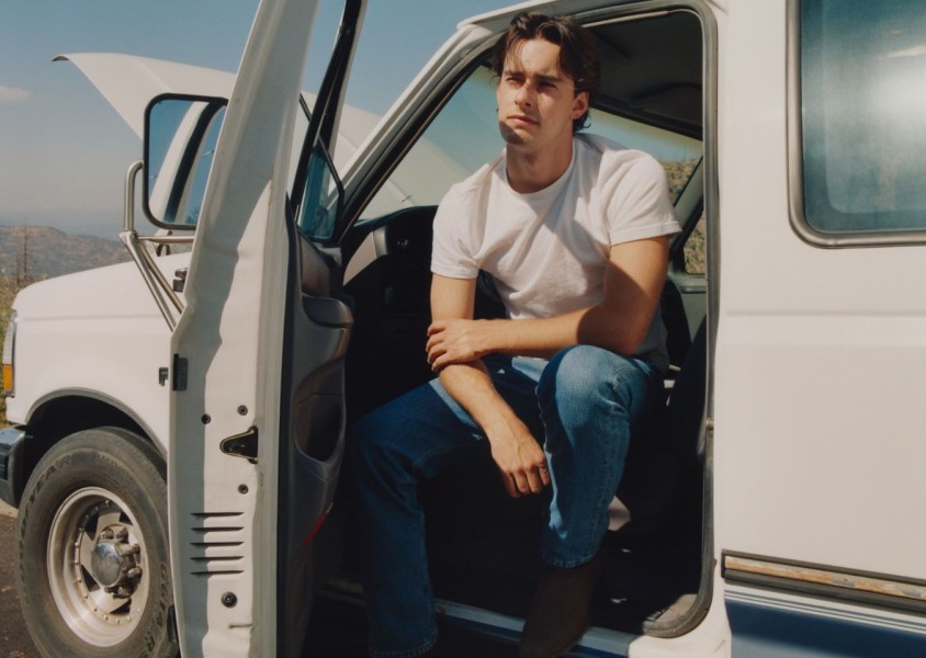 Noah Rinker sat in the drivers seat of a white vehiclex